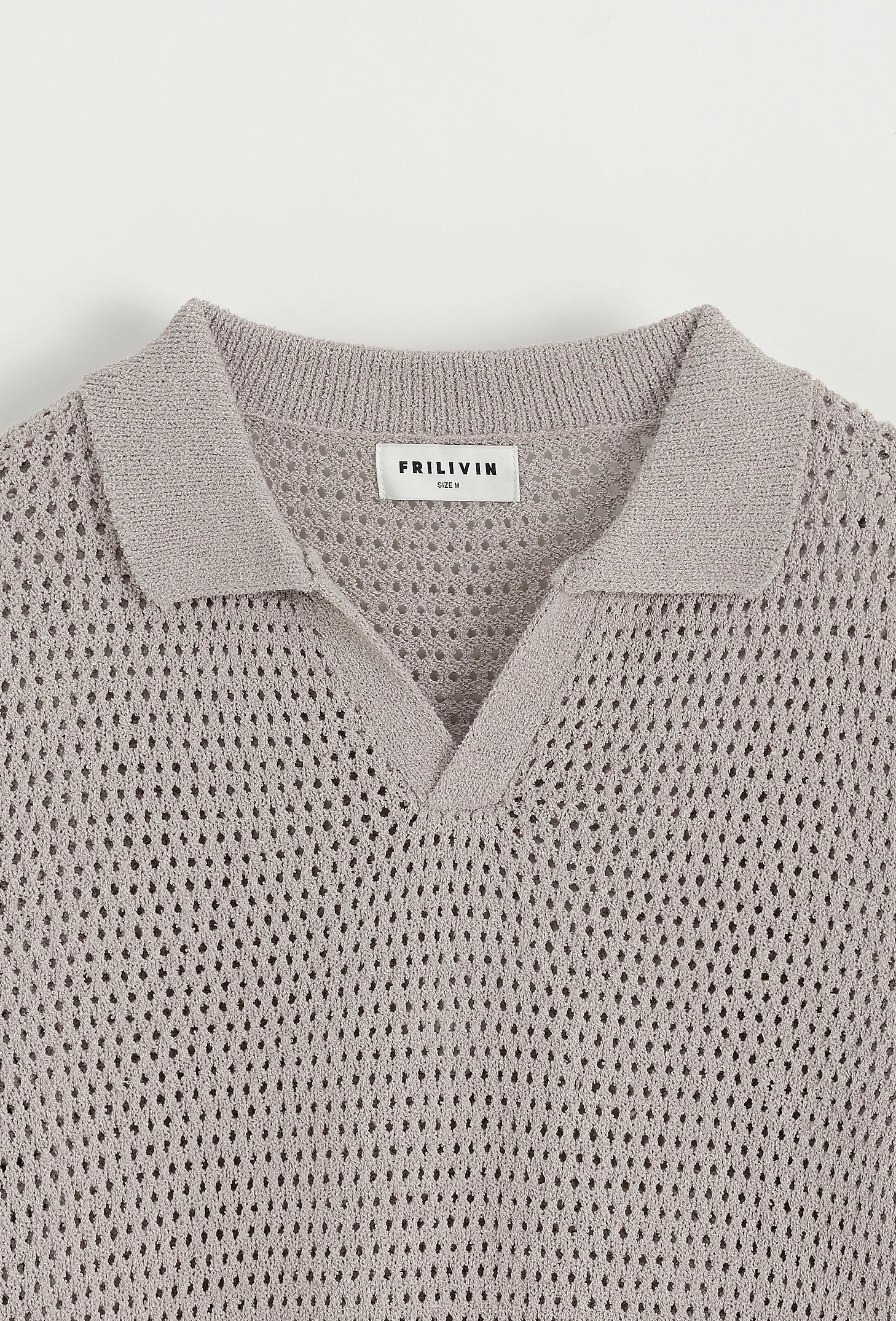 Polo troué uni à manches courtes