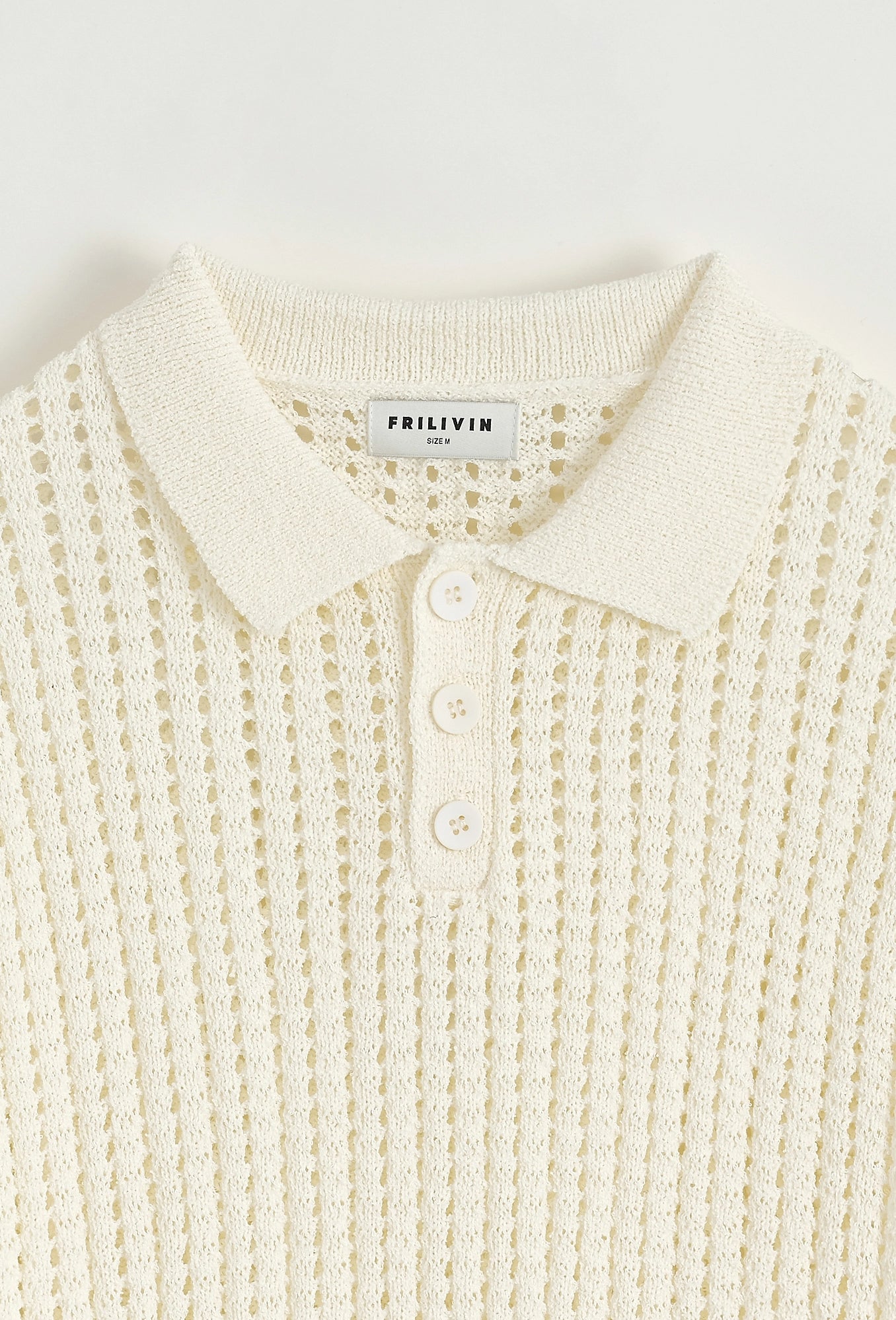 Polo troué uni à manches courtes