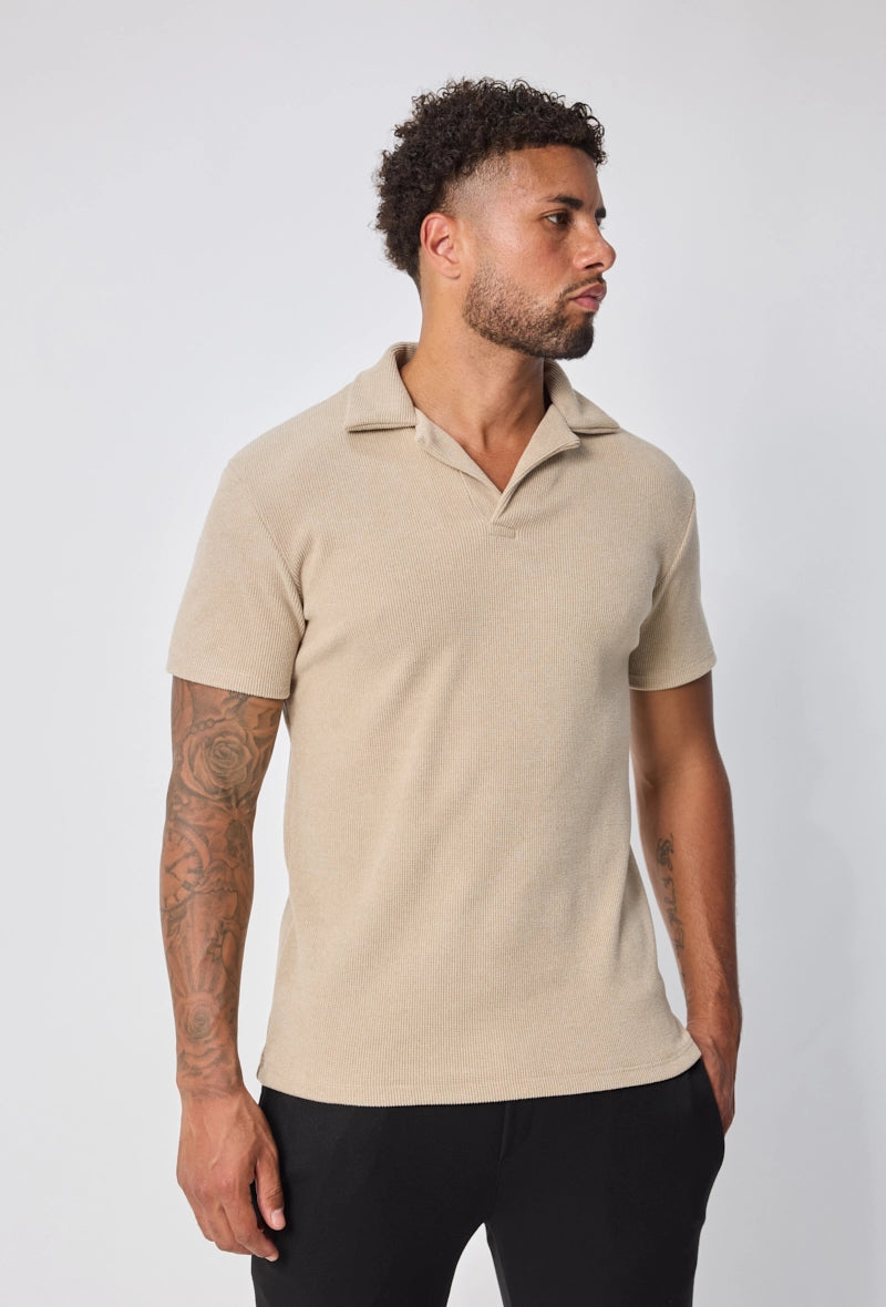 Polo uni col v à revers