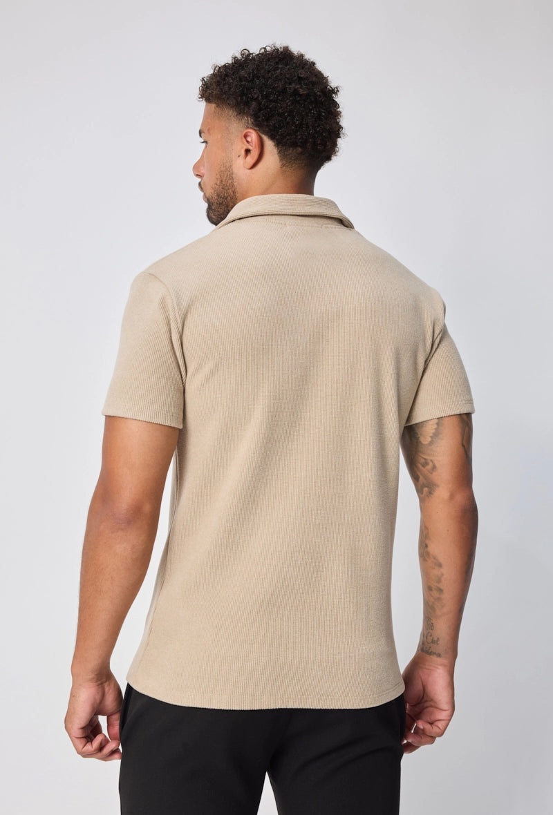 Polo uni col v à revers