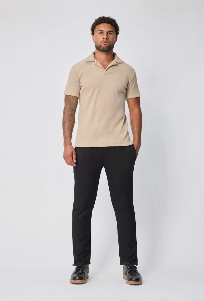 Polo uni col v à revers