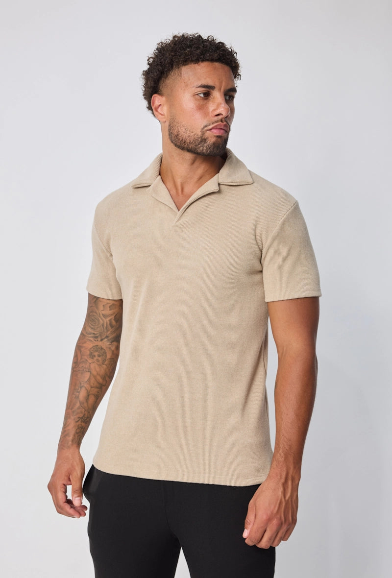 Polo uni col v à revers