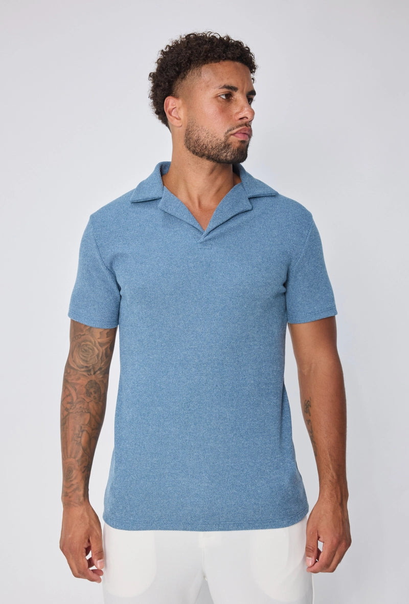 Polo uni col v à revers