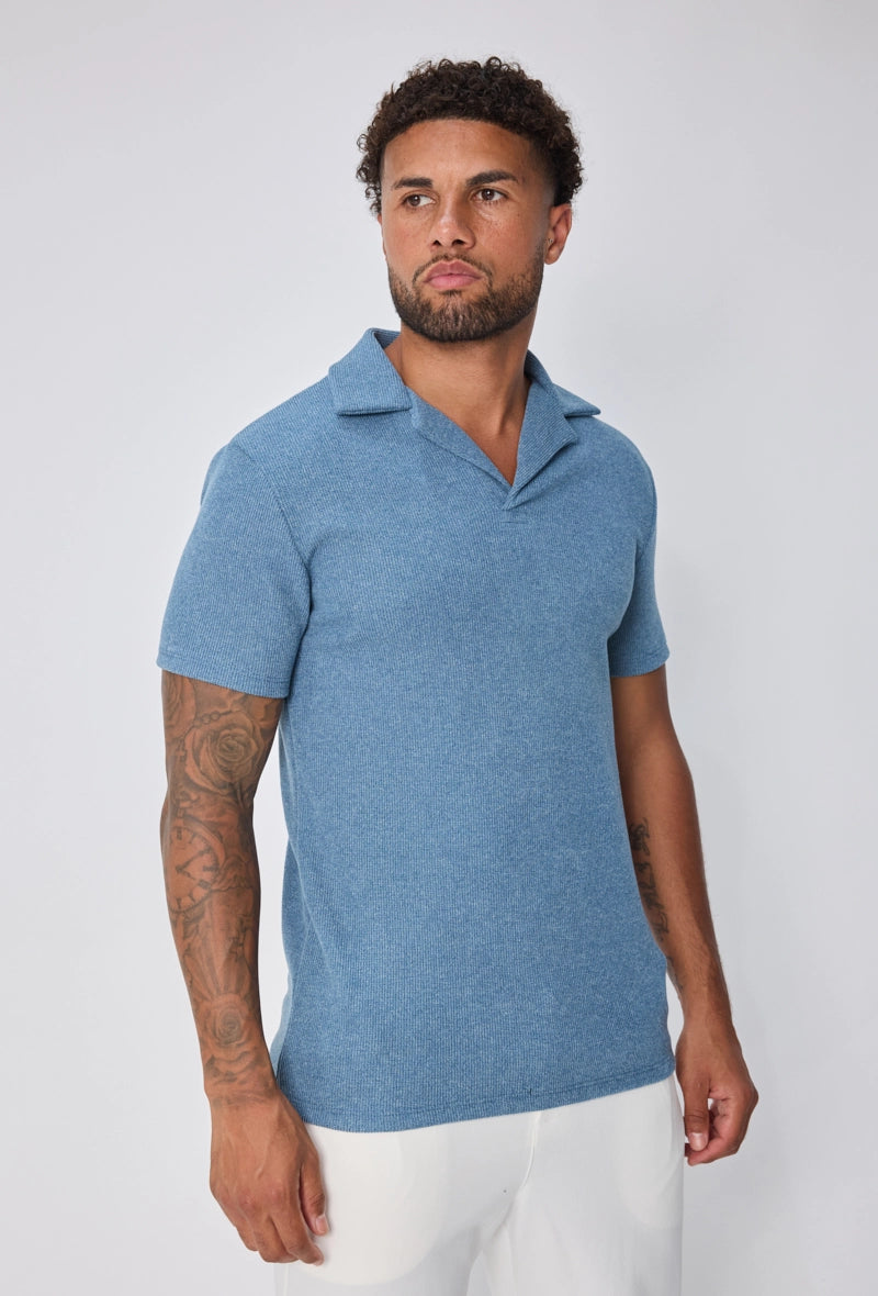 Polo uni col v à revers