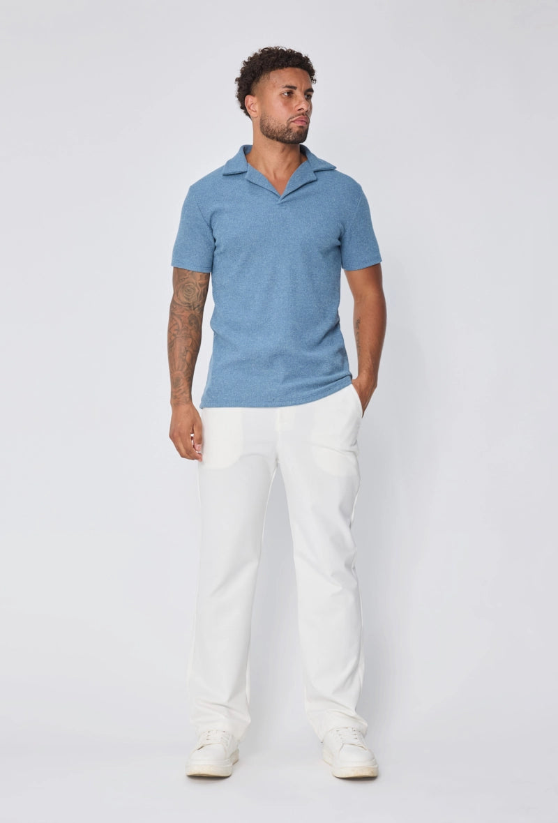 Polo uni col v à revers