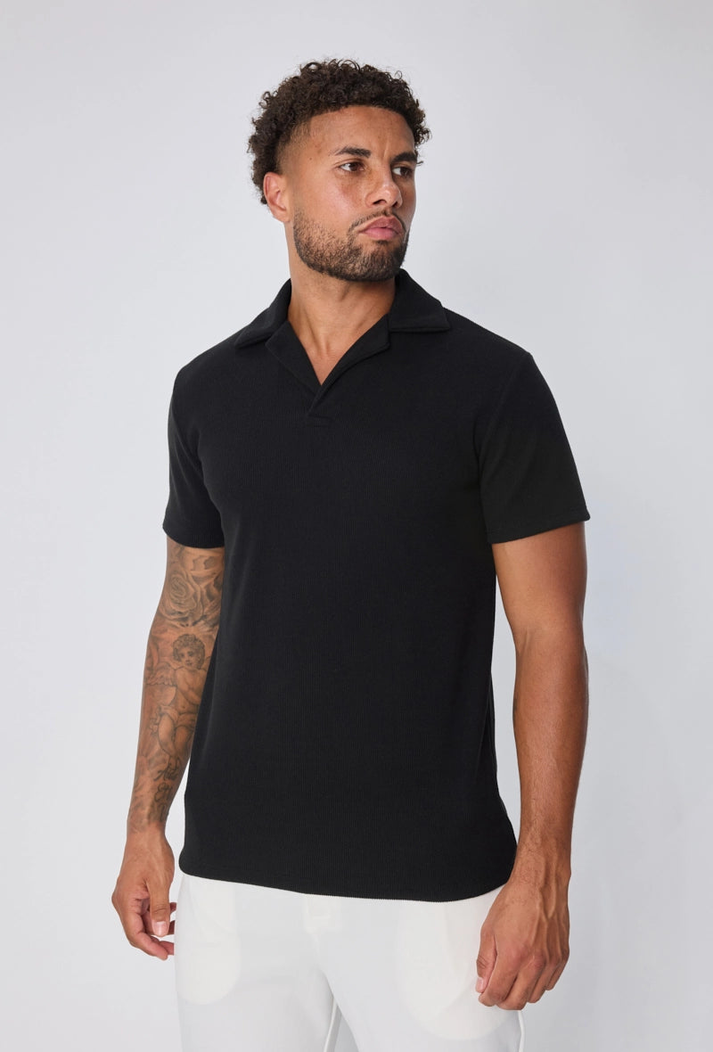 Polo uni col v à revers