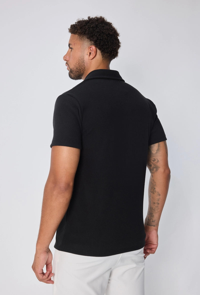 Polo uni col v à revers