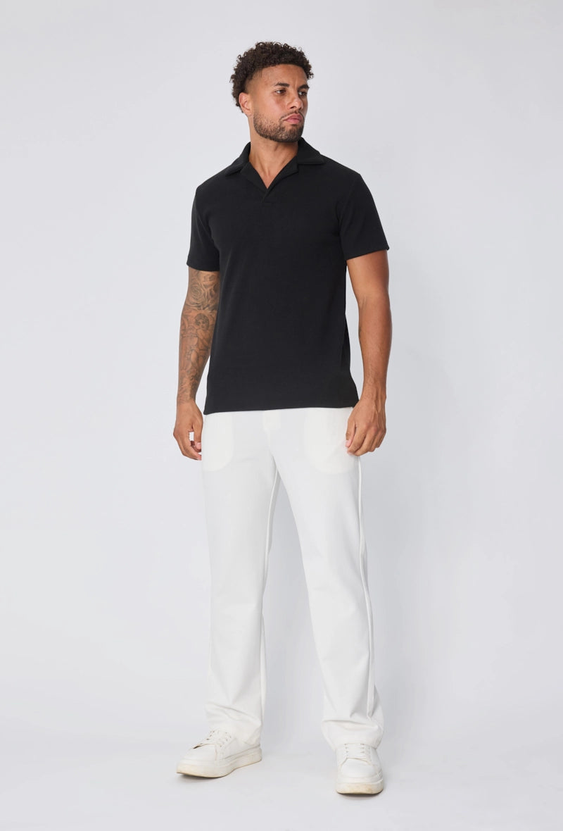 Polo uni col v à revers