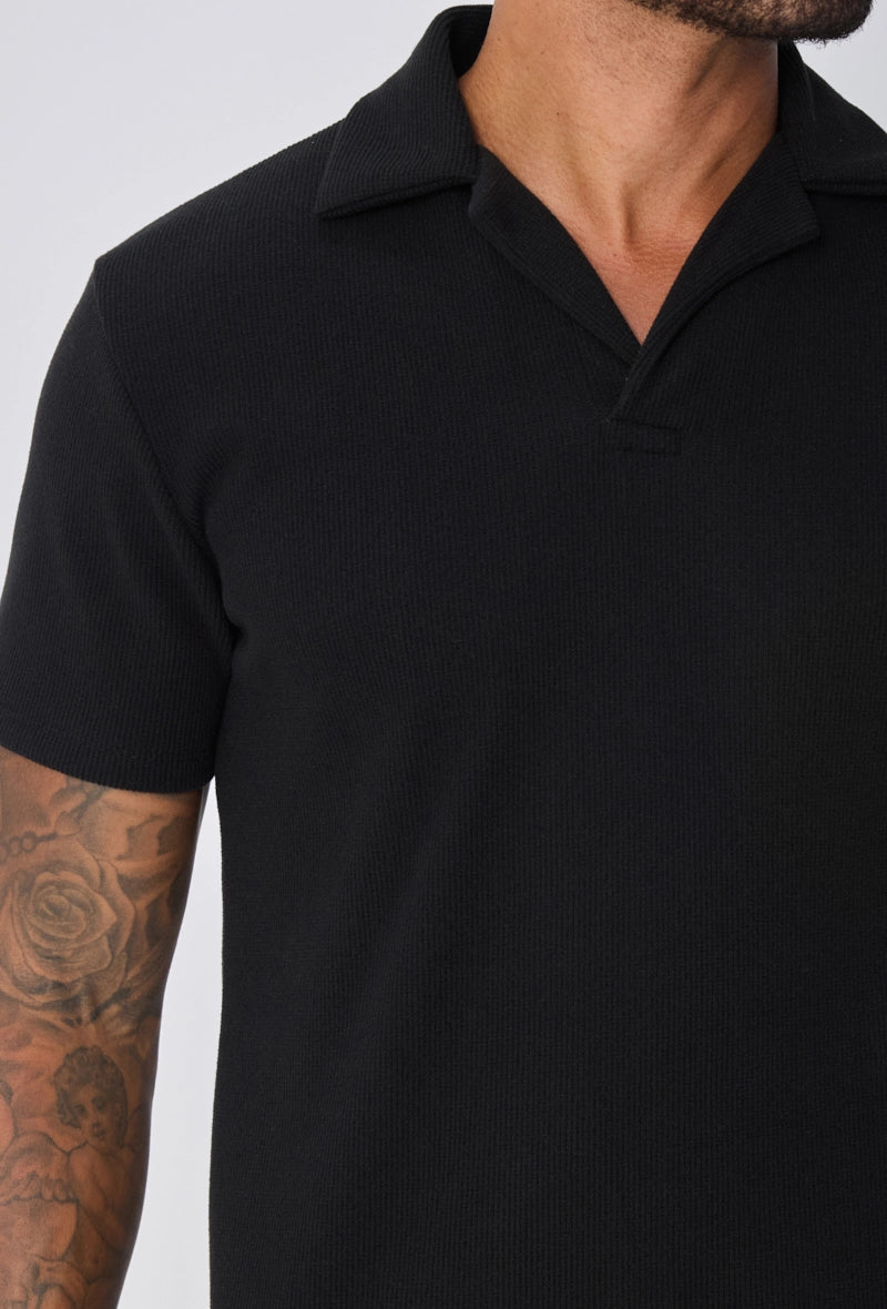 Polo uni col v à revers