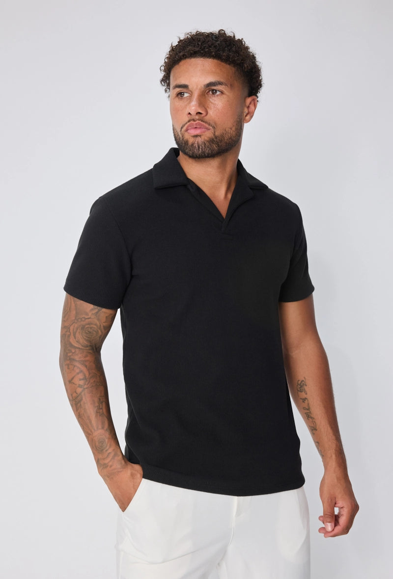 Polo uni col v à revers