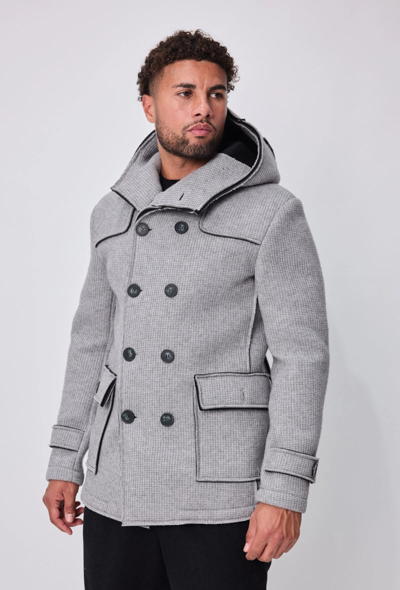 Manteau avec capuche et col large