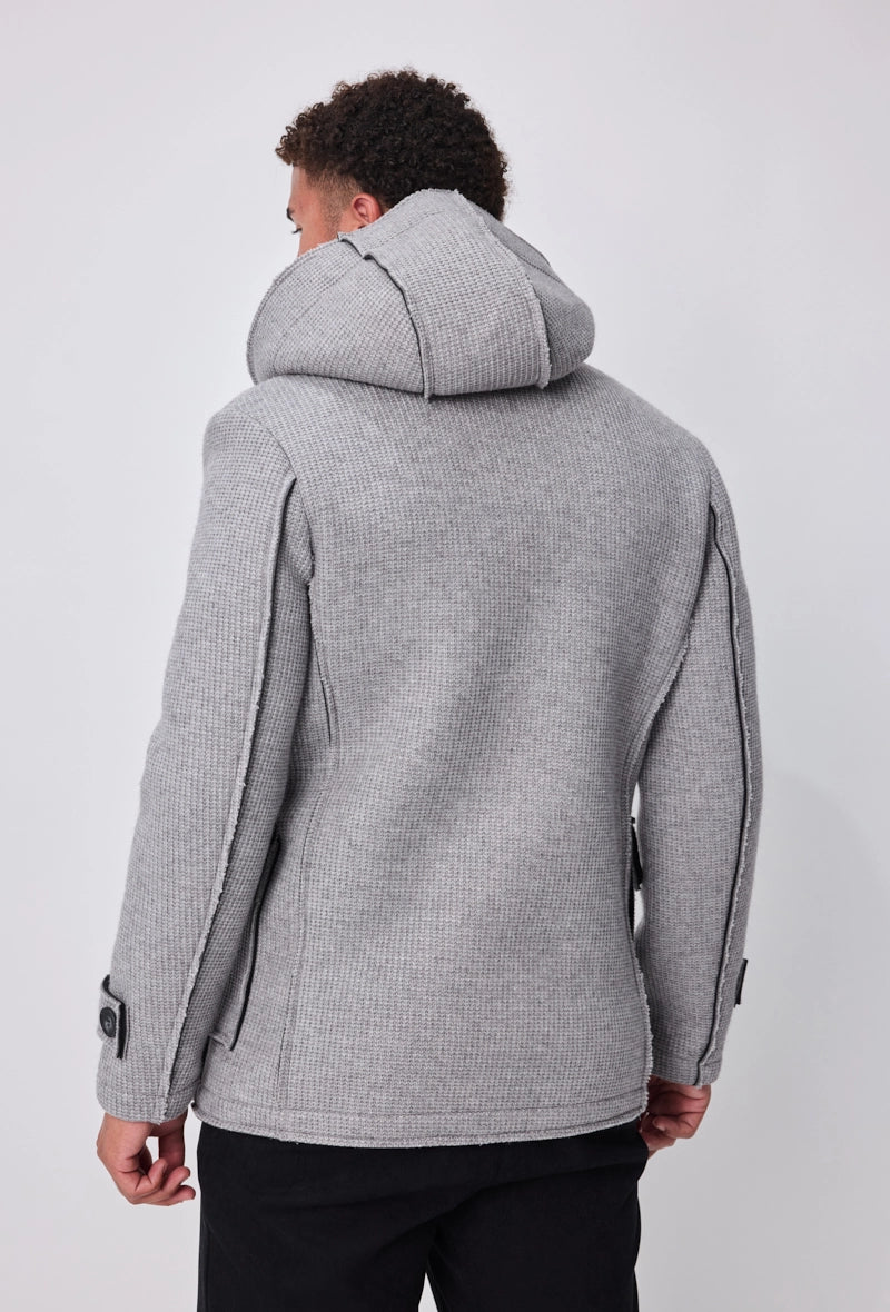 Manteau avec capuche et col large