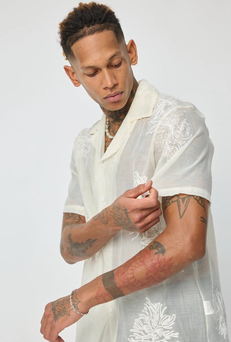 Chemise manches courtes à motifs fleuris broder