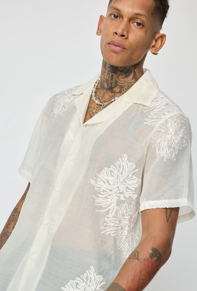 Chemise manches courtes à motifs fleuris broder