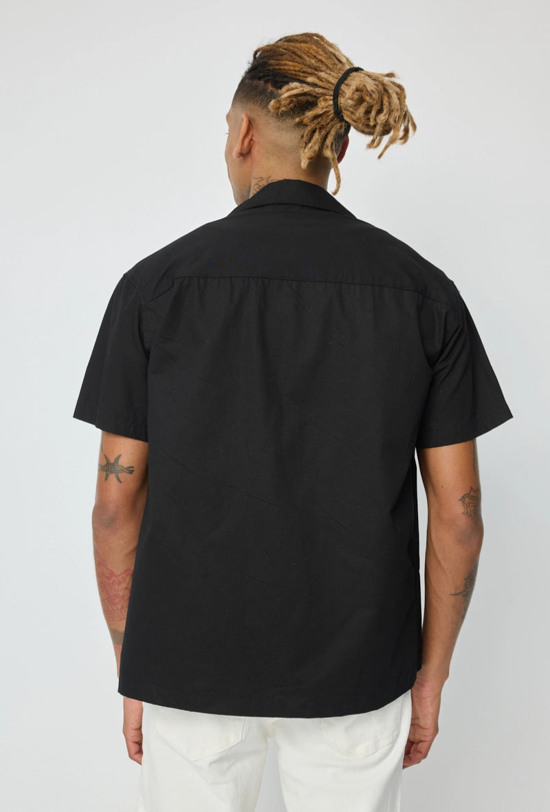 Chemise unie manches courtes