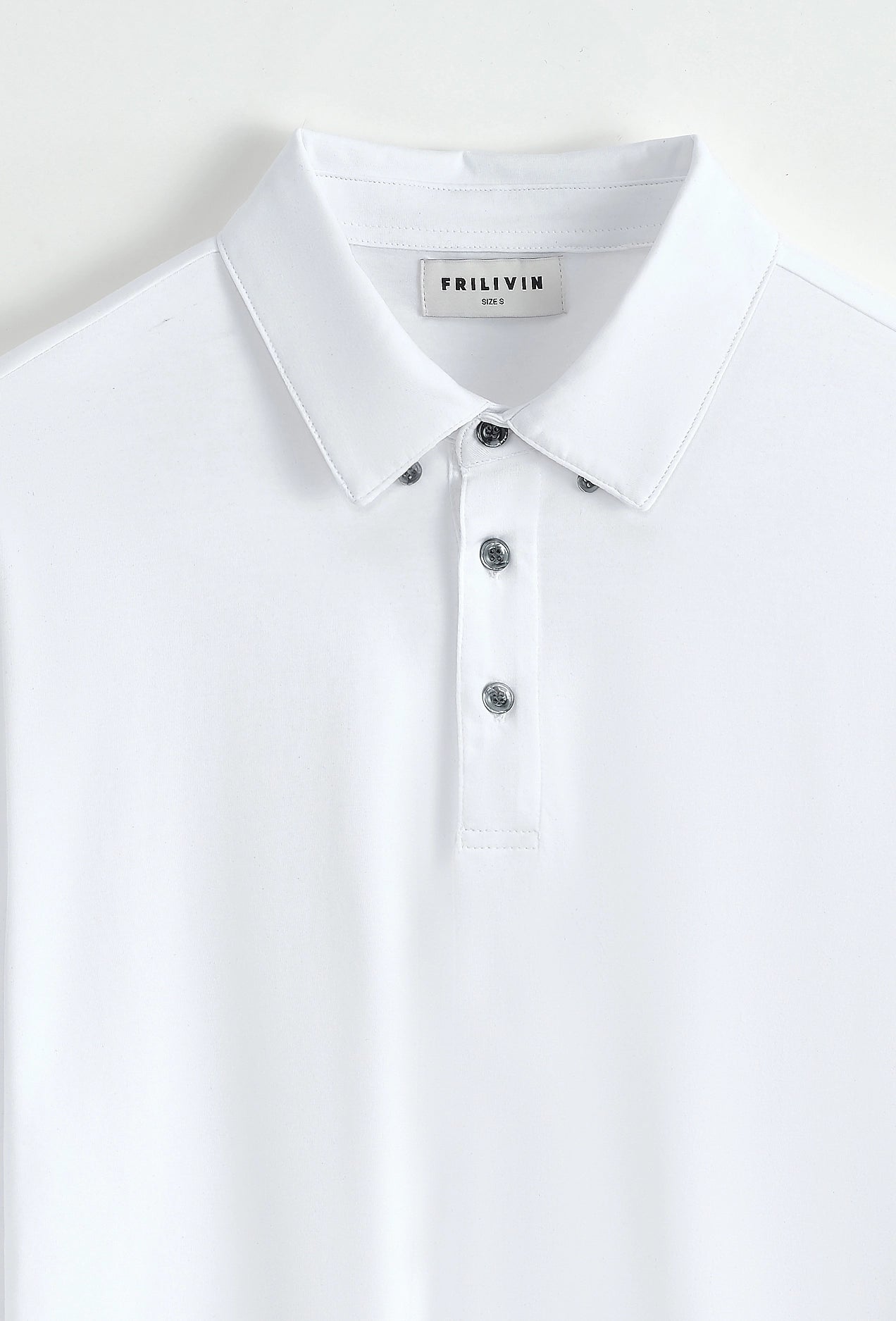 Polo uni à manches longues