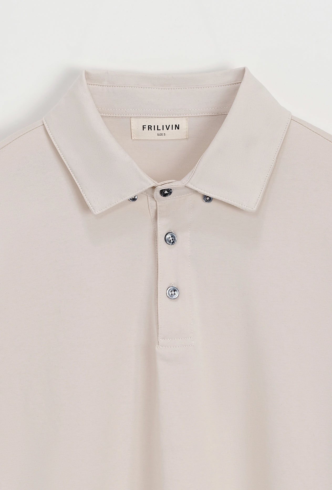 Polo uni à manches longues