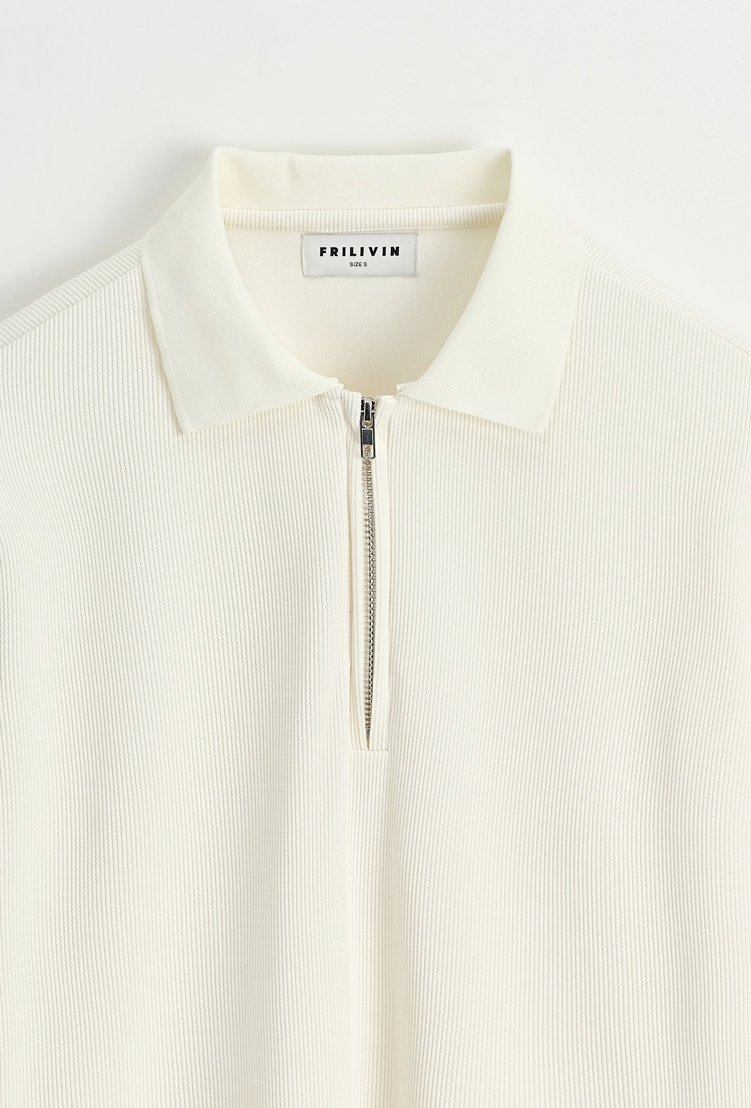 Polo à manches longues avec col zippé