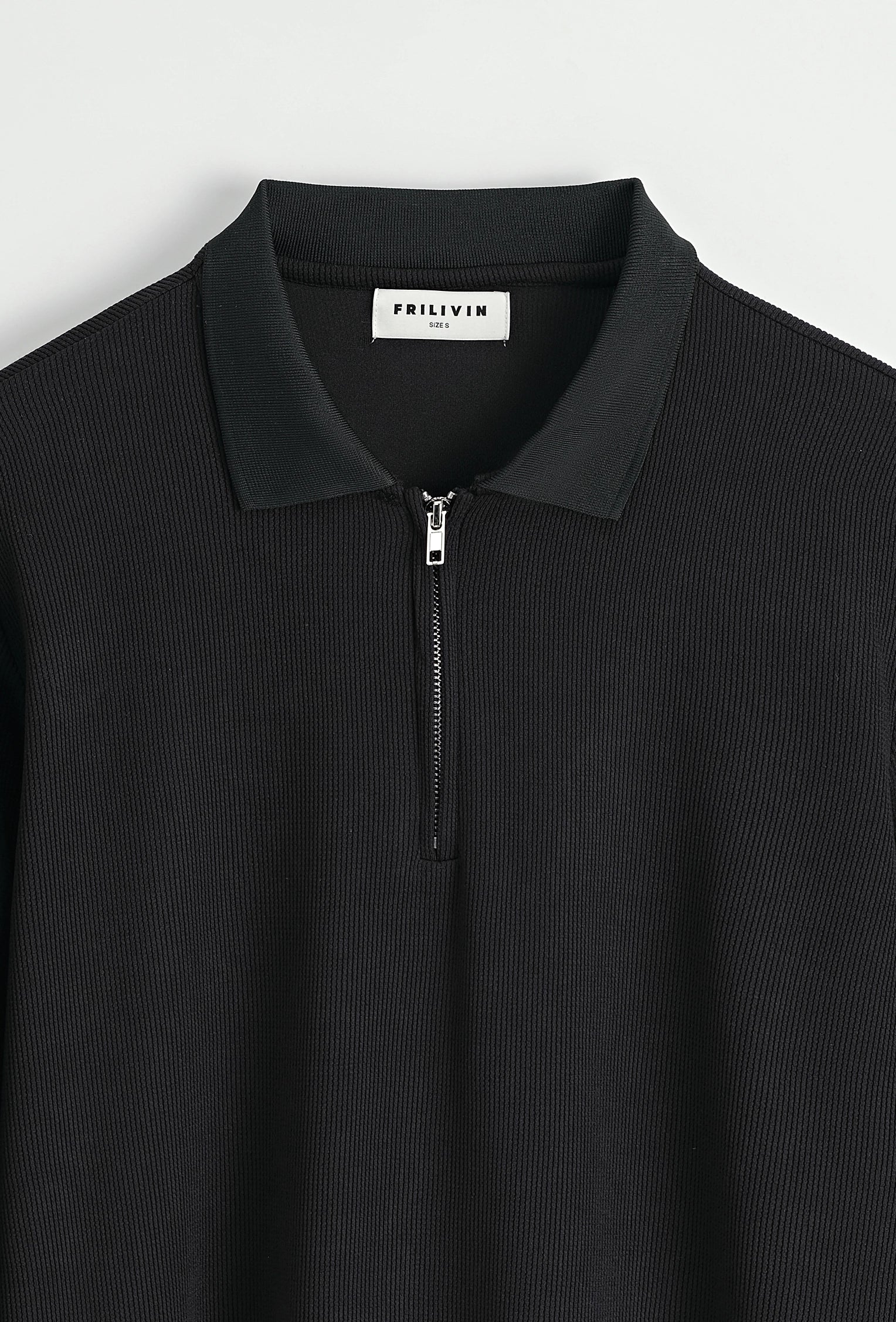 Polo à manches longues avec col zippé