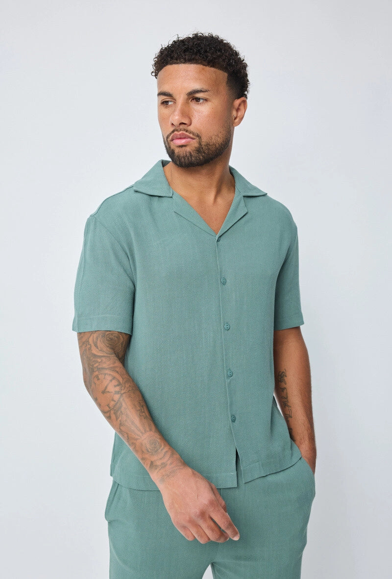 Chemise unie à boutons manches courtes