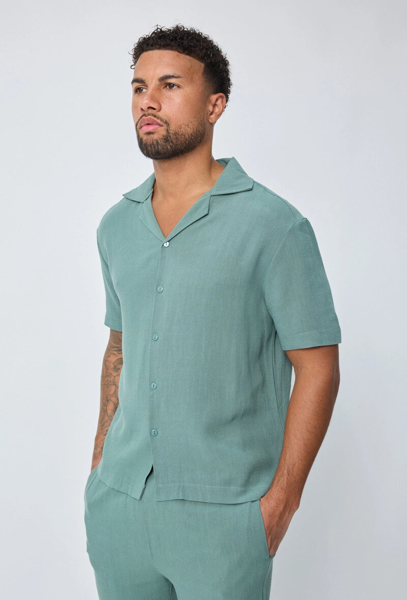 Chemise unie à boutons manches courtes