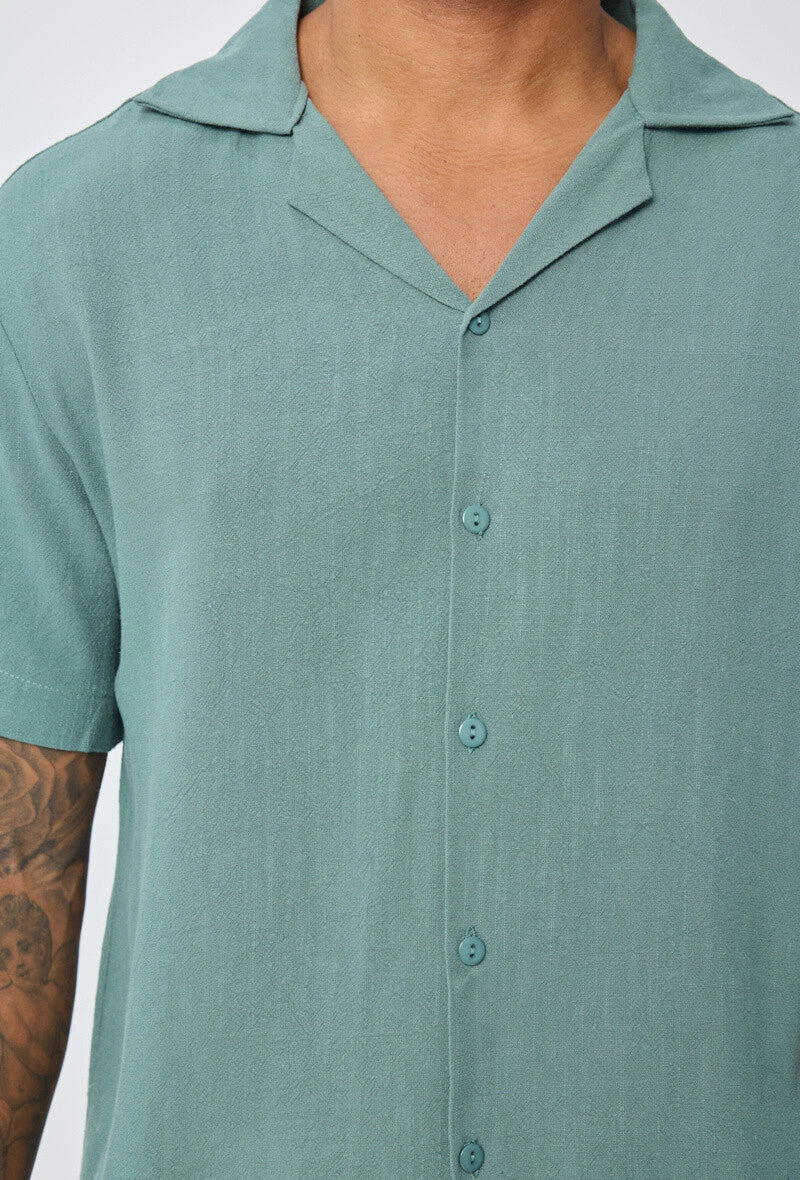 Chemise unie à boutons manches courtes