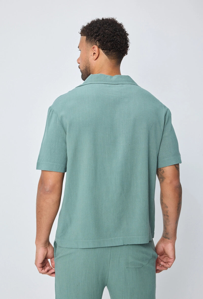 Chemise unie à boutons manches courtes