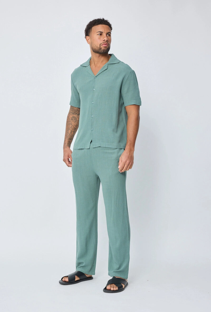 Chemise unie à boutons manches courtes