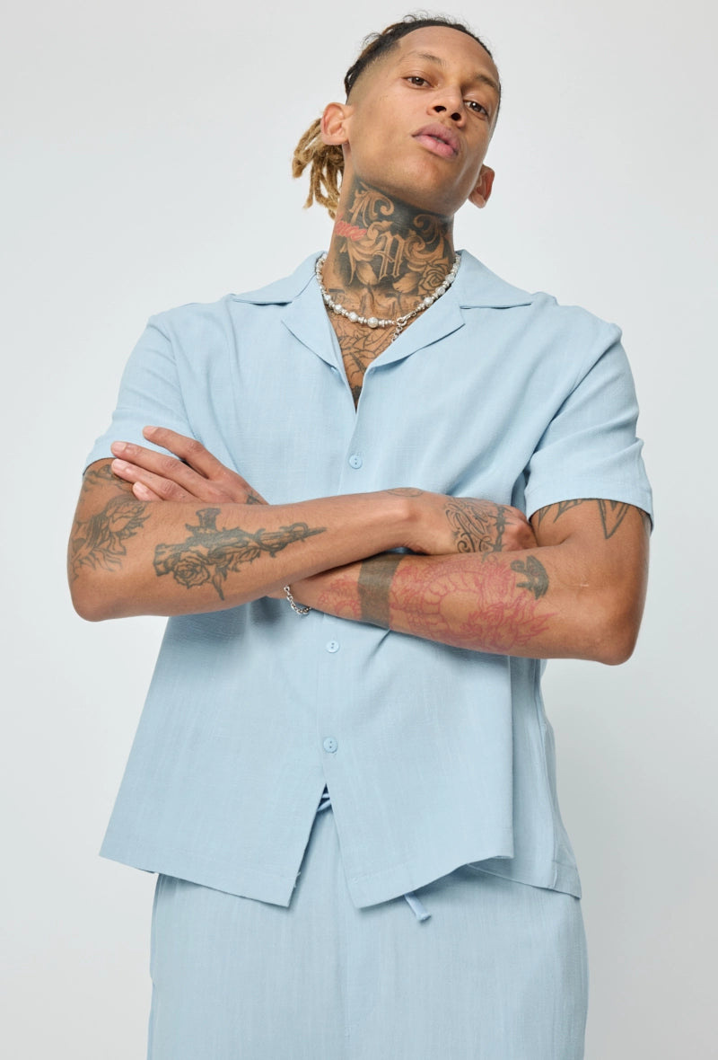 Chemise unie à boutons manches courtes