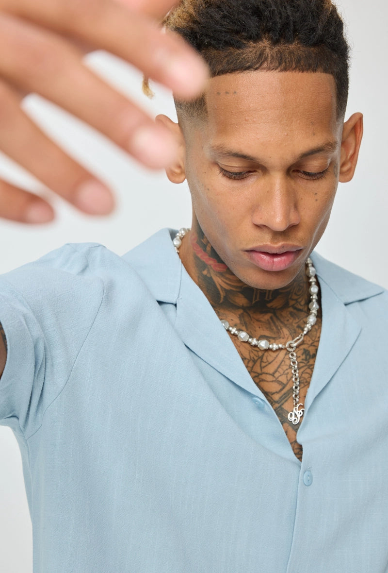 Chemise unie à boutons manches courtes