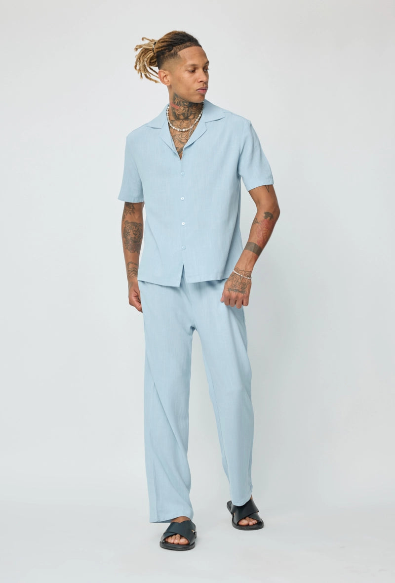 Chemise unie à boutons manches courtes