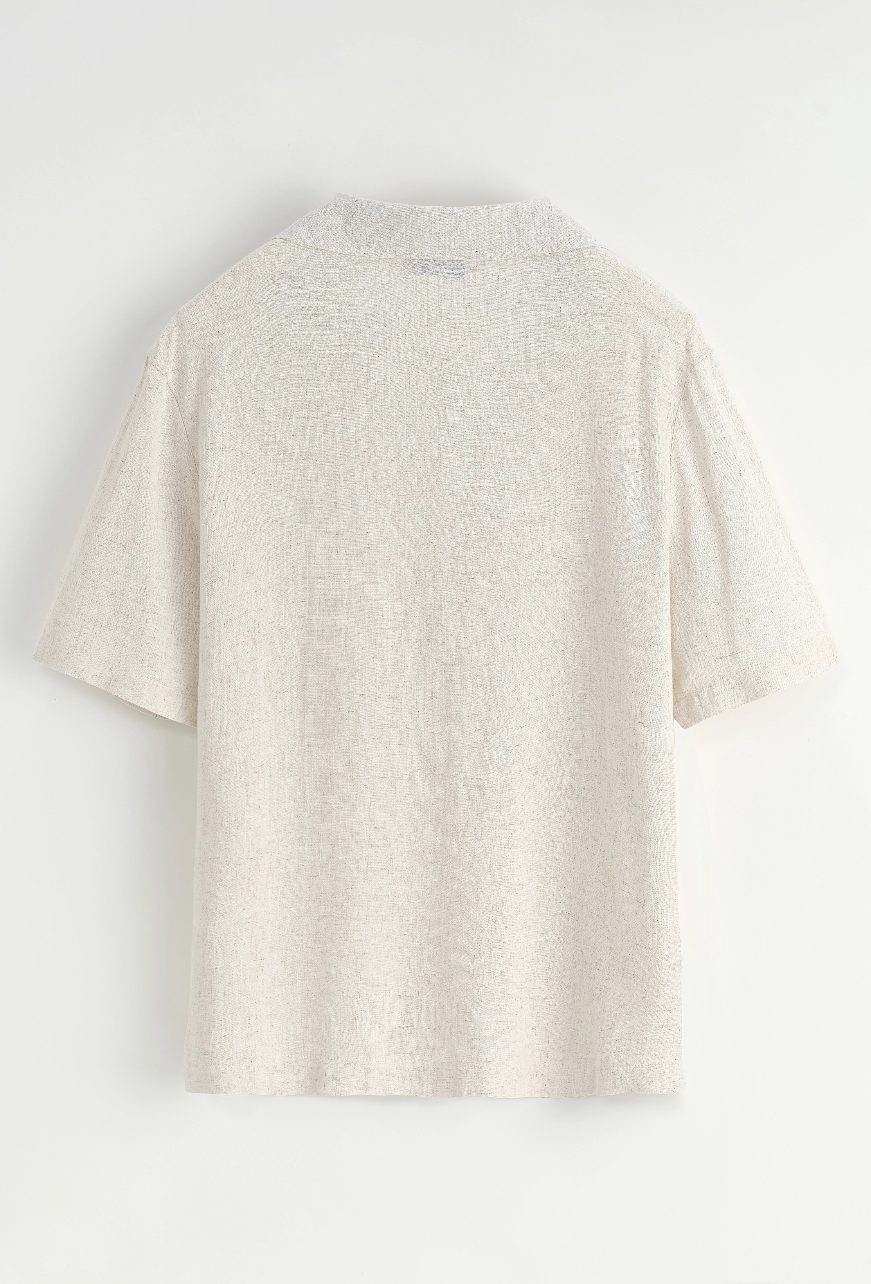 Chemise unie à boutons manches courtes