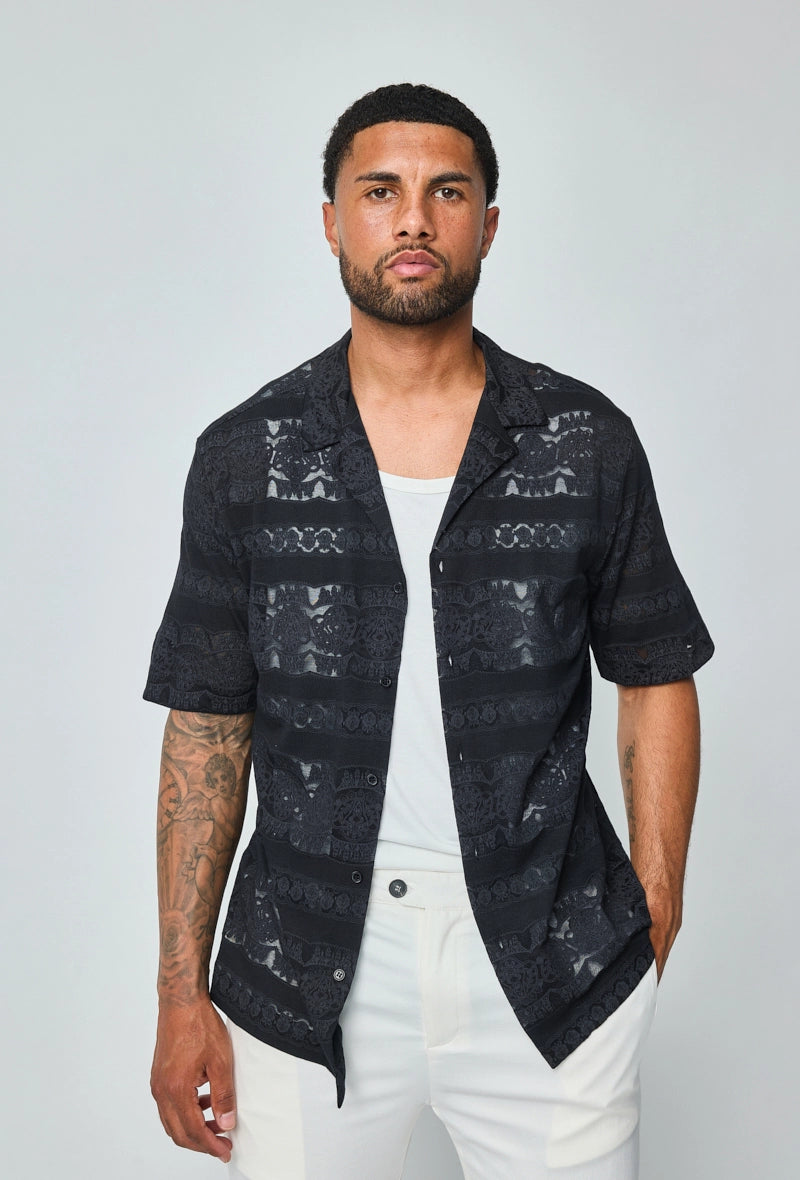 Chemise unie manches courtes à motifs