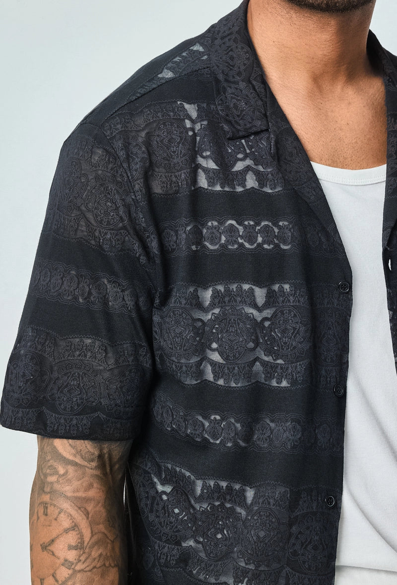 Chemise unie manches courtes à motifs