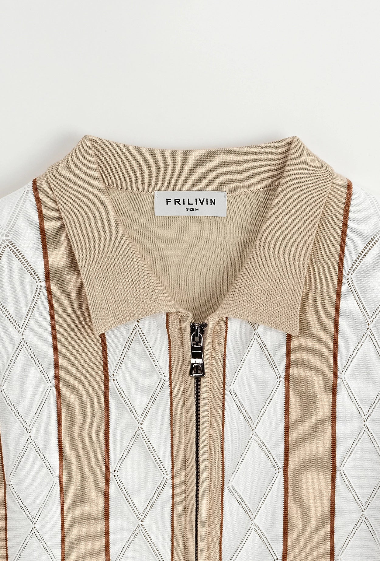 Polo manches courtes à zip en rayures