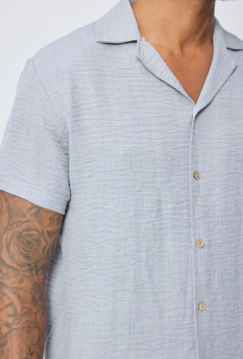 Chemise manches courtes à bouton