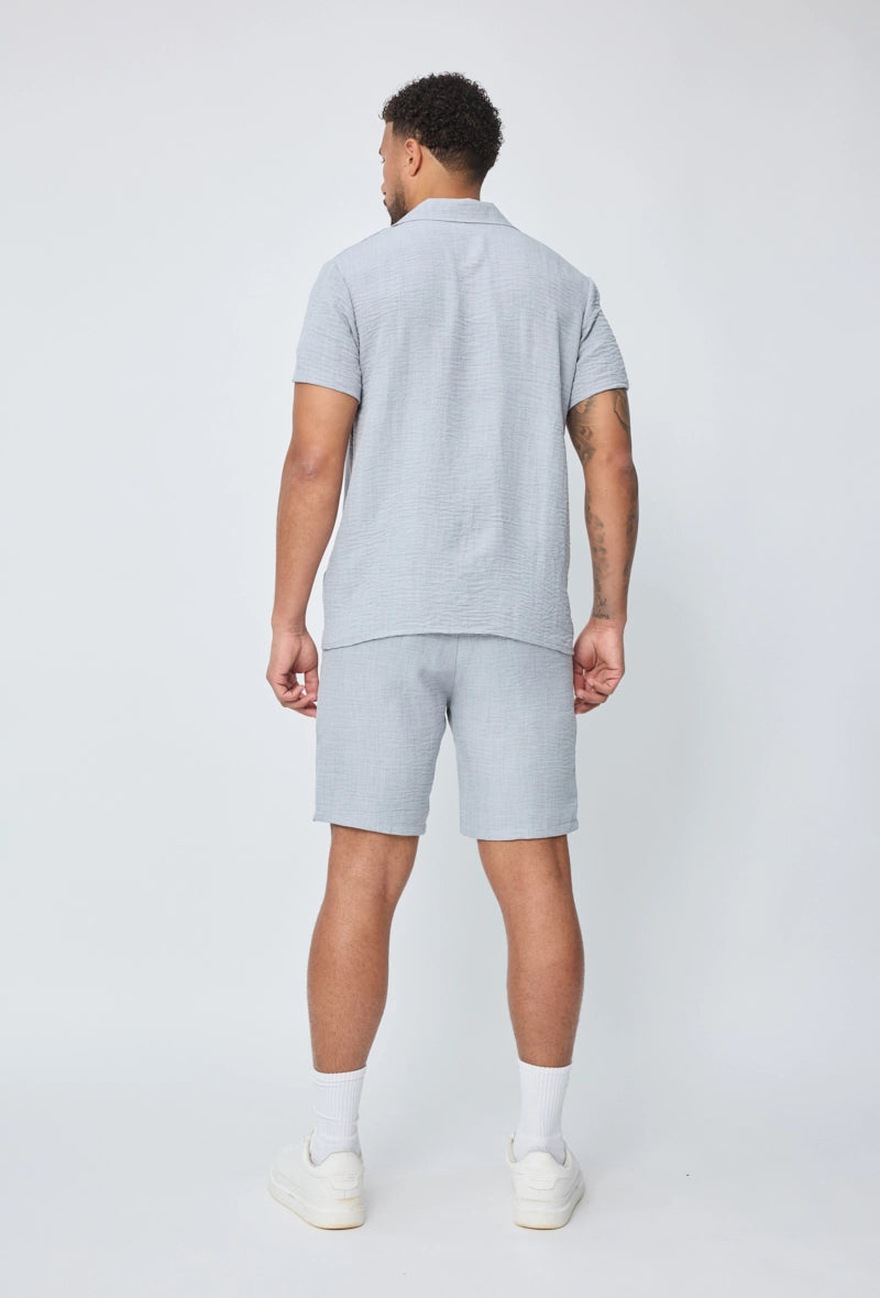 Chemise manches courtes à bouton