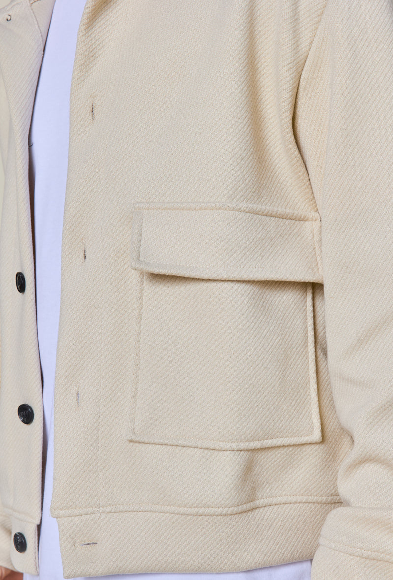 Plain textured jacket with large flap pockets