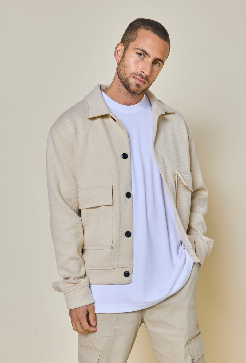 Plain textured jacket with large flap pockets