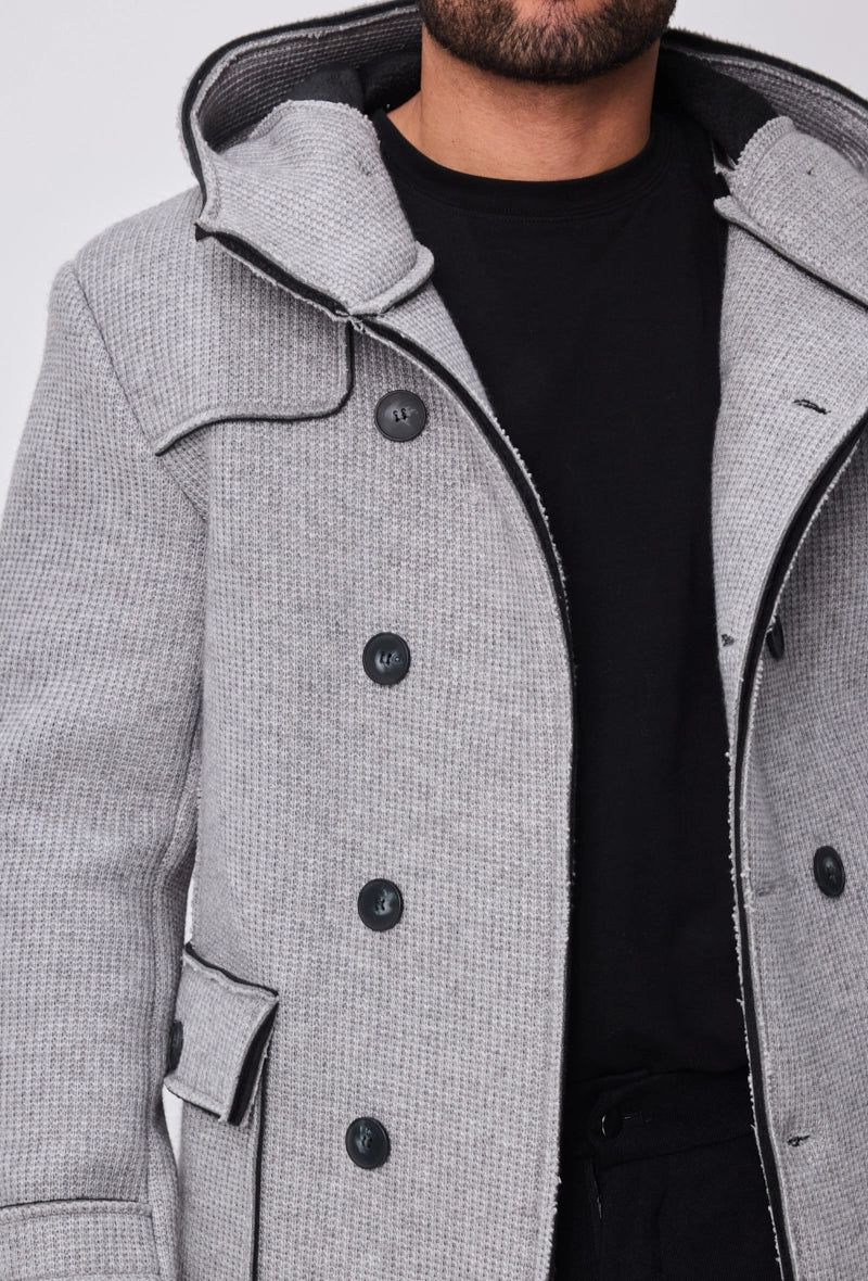 Manteau avec capuche et col large