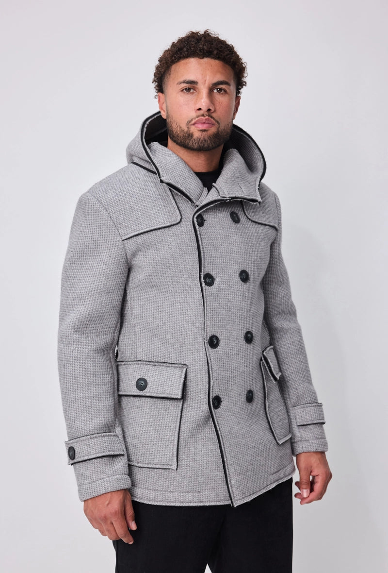 Manteau avec capuche et col large