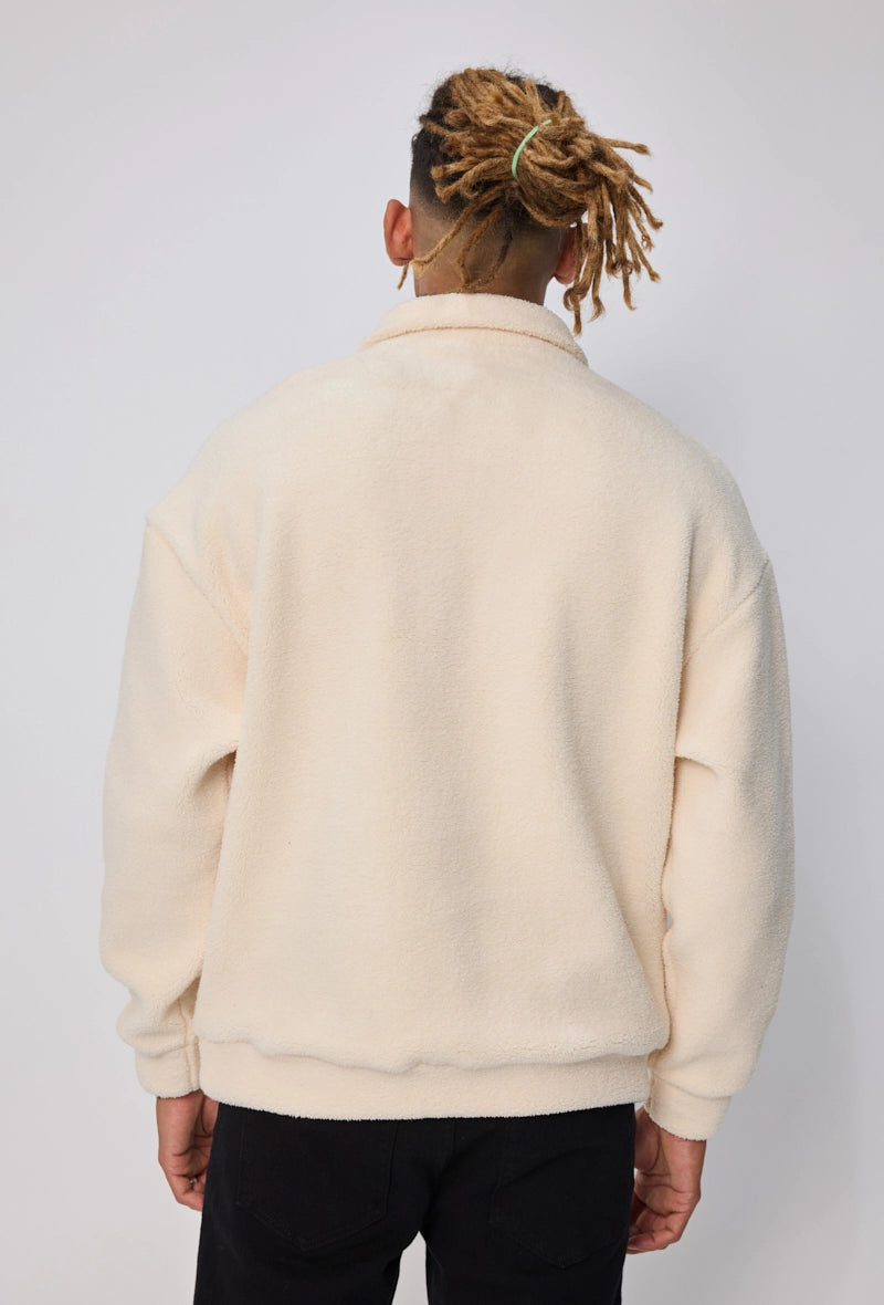 Sweat uni à zip col à revers