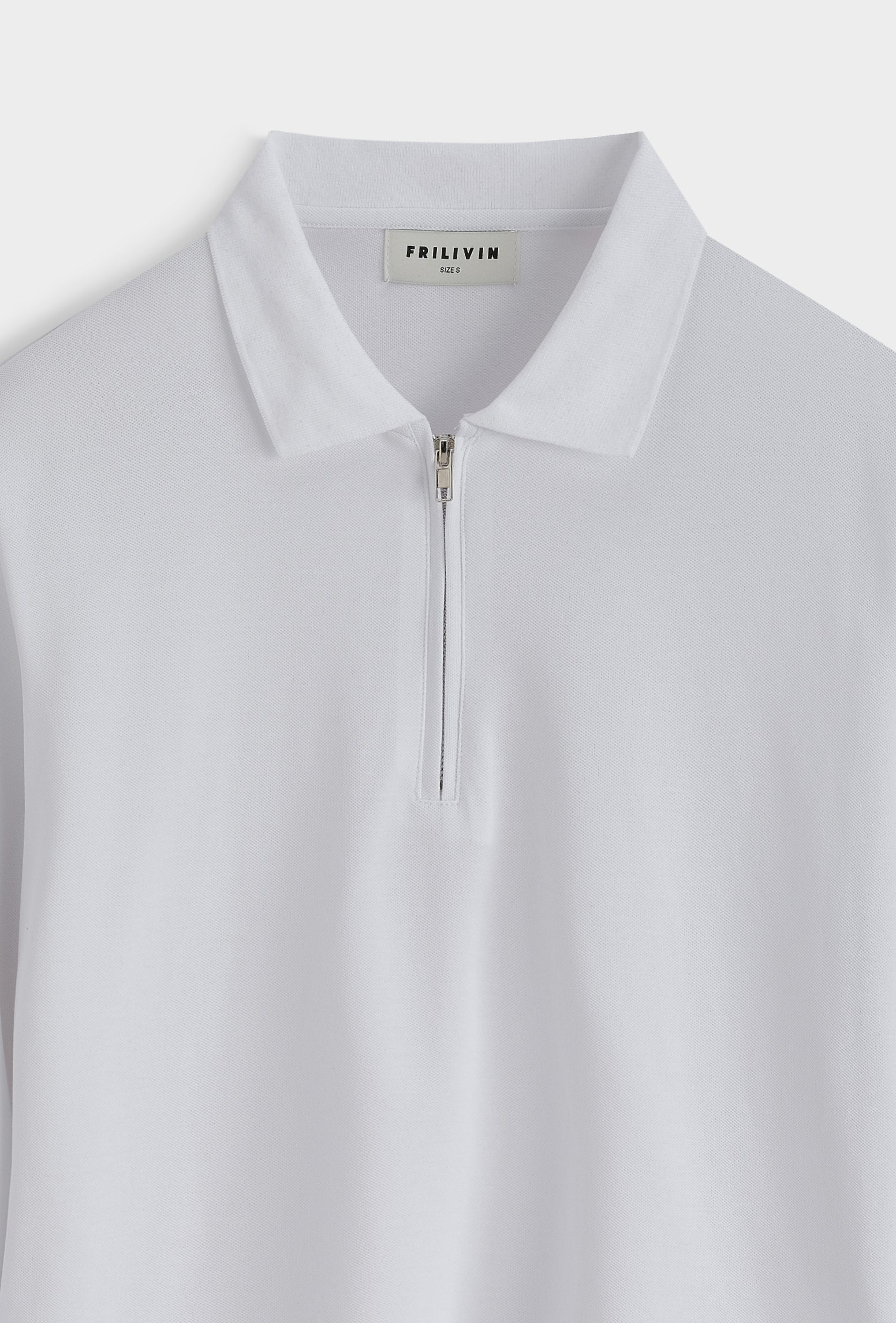 Polo zippé slim