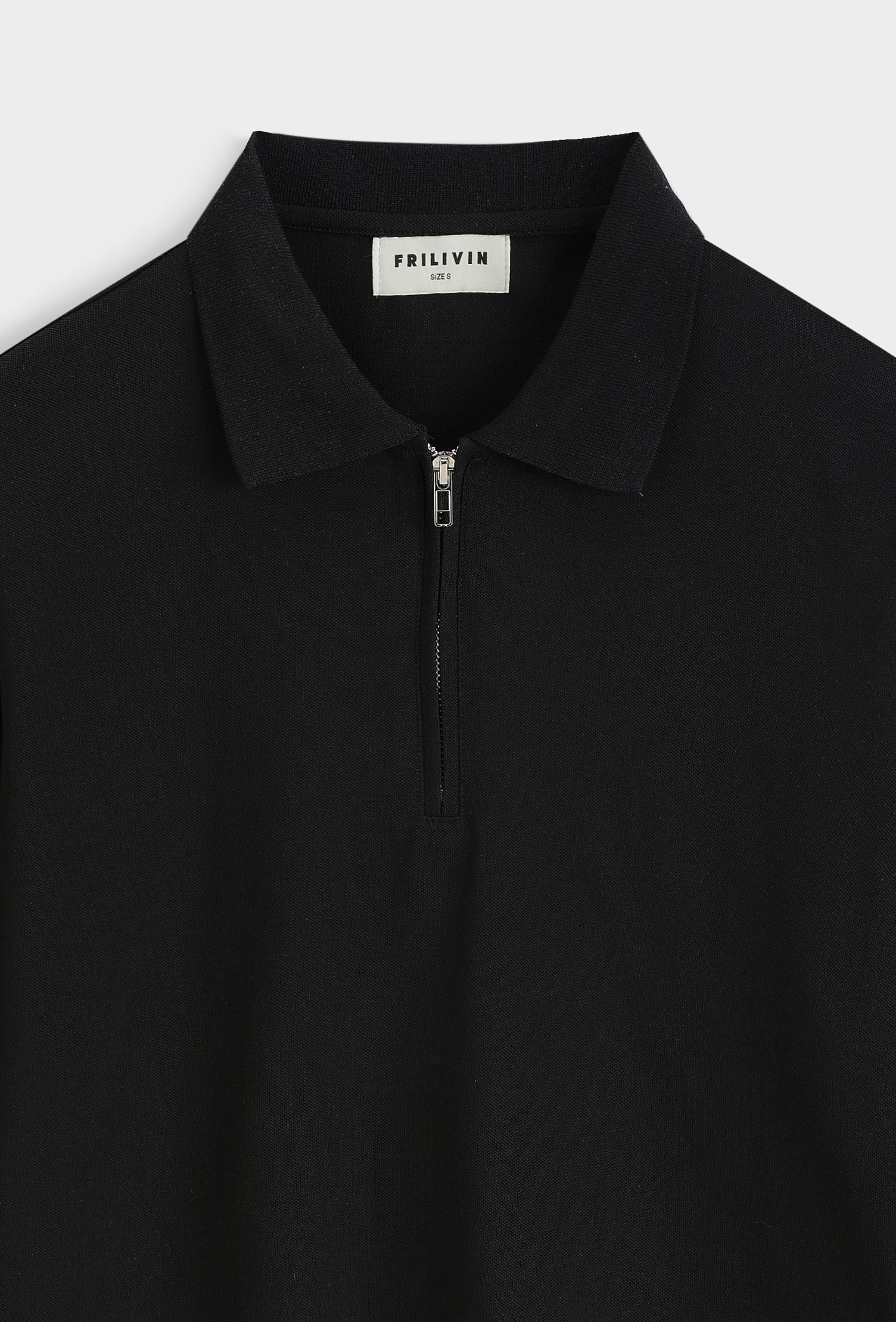 Polo zippé slim