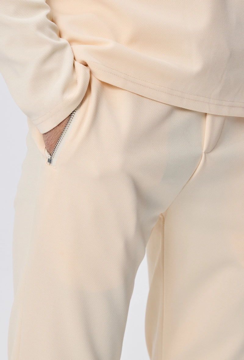 Ensemble polo manches longues à zip uni avec pantalon uni