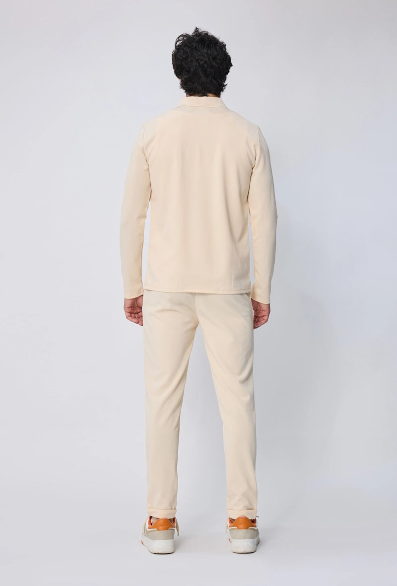 Ensemble polo manches longues à zip uni avec pantalon uni