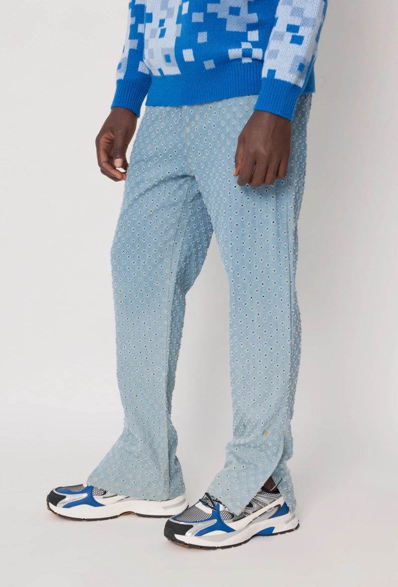 Jean large à motifs troués