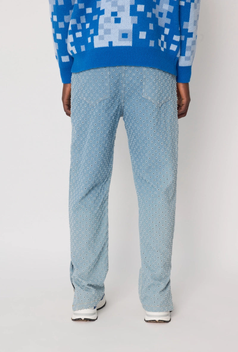 Jean large à motifs troués