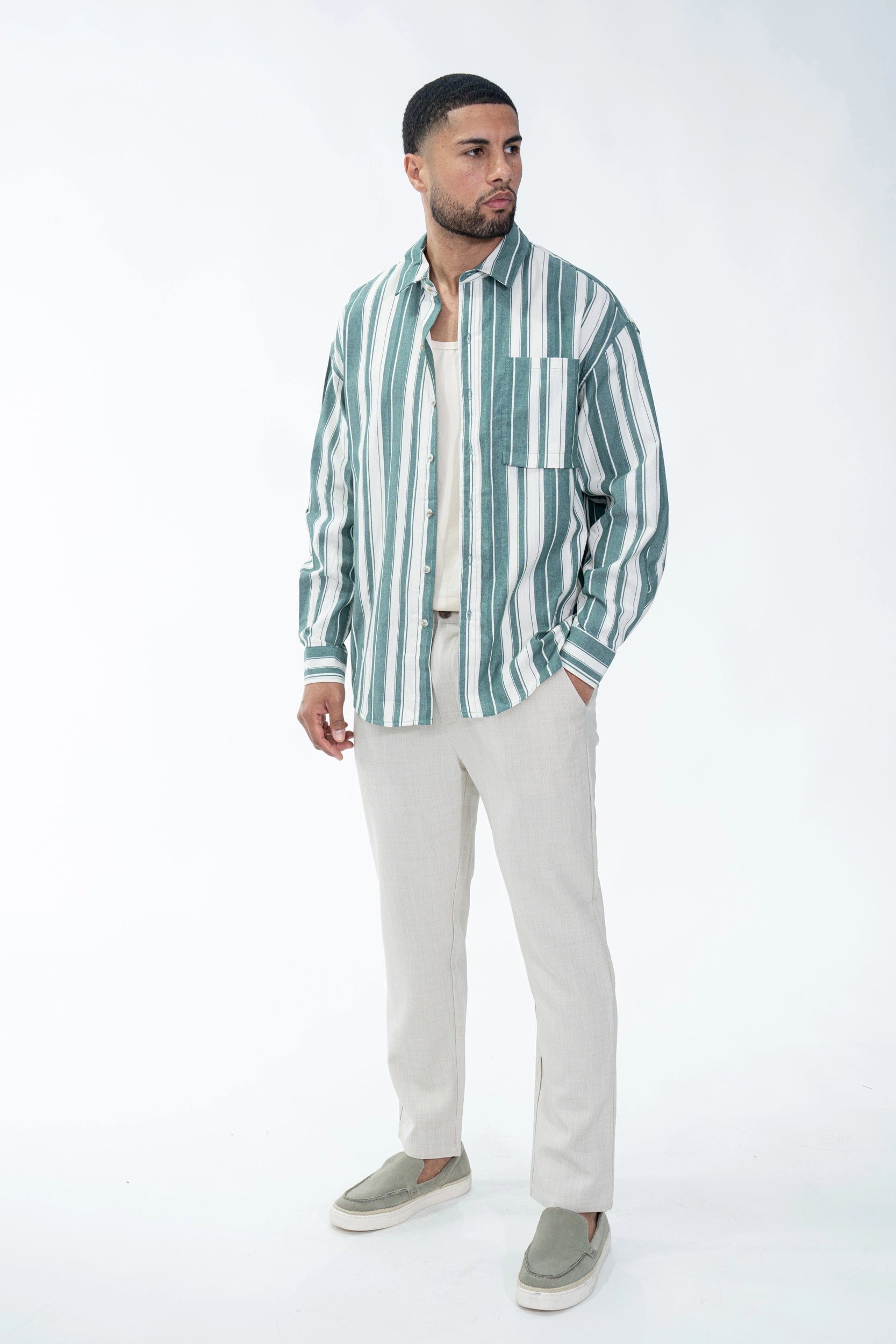 Long-sleeved shirt with vertical stripes and chest pocket