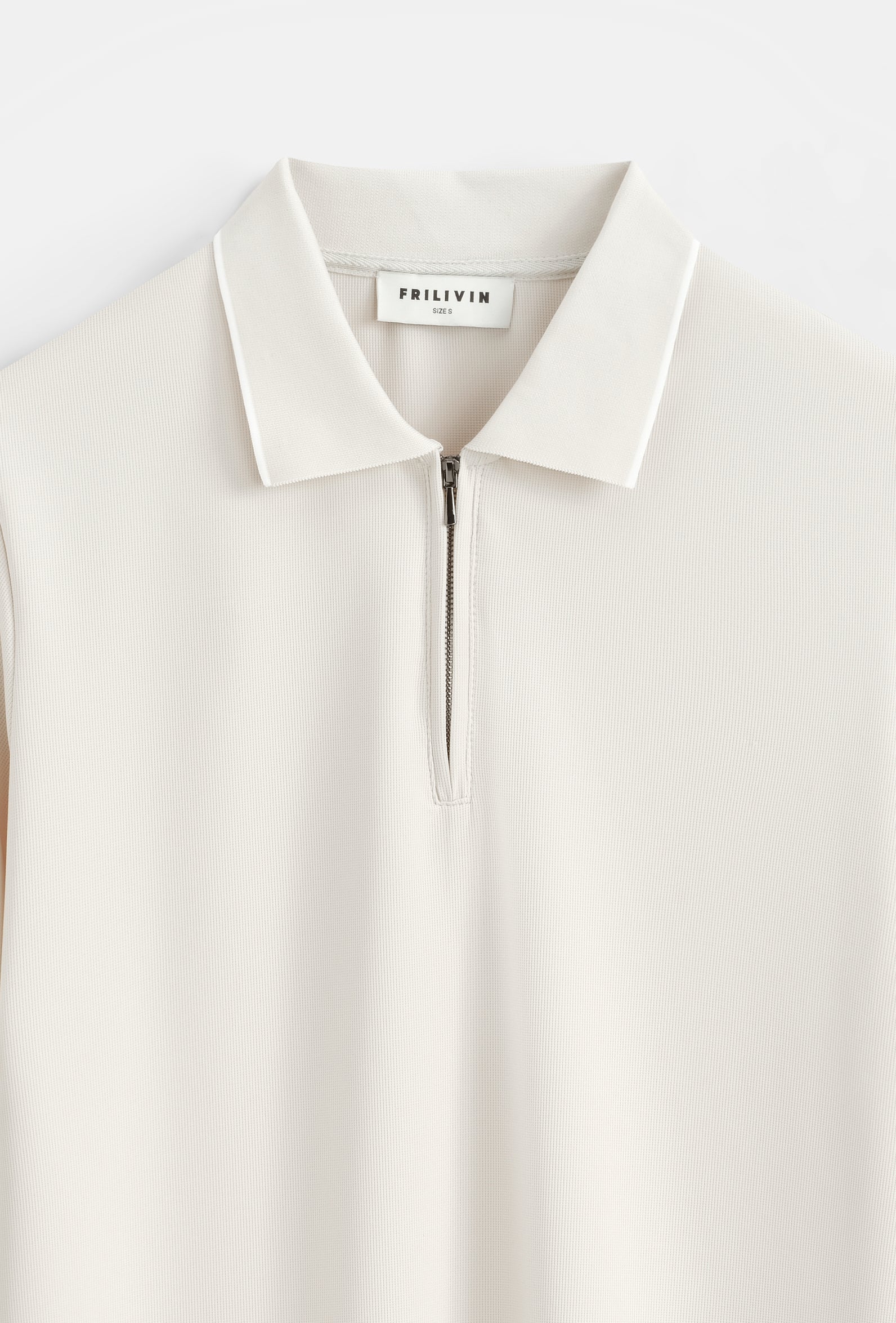 Polo zippé col contrasté